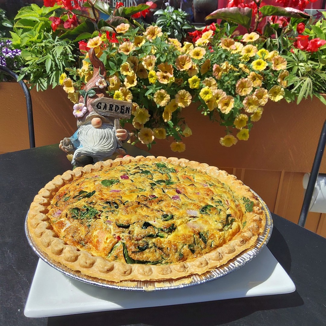 Our garden quiche is in full bloom! Come on in and grab a slice before it's gone. Spinach, tomatoes, onions and cheese blend perfectly with a crispy crust! 

#TheGnoshery #GnomeGamesSBY #Breakfast #BrunchTime #Gnome #GnoshGnosh