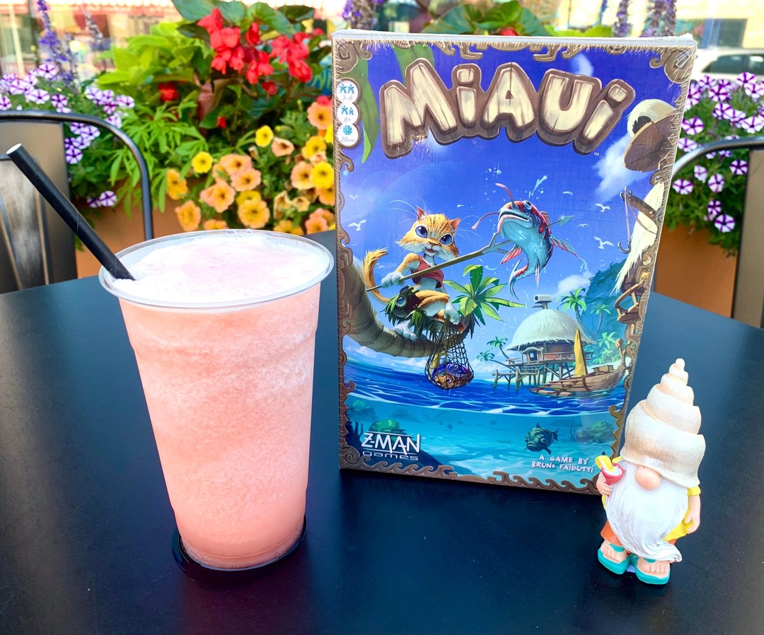 Happy National Kitten Day! No cats? No Pur-ablem! 😸

Celebrate by grabbing one of our limited July Miaui Wowie Slushies! This beautiful pink drink hold flavors of peaches and hibiscus lemonade! Very refreshing on a hot July day!

While your here check out the tropical, feline board game this drink is appropriately named after! In Miaui, compete to see who can catch the most valuable fish before the nightly feast! Keep an eye out for jellyfish and seagulls, so they don't seal your catch! 

 #midwest #boardgamer #boardgamesofinstagram #boardgamegeek #boardgame #sturgeonbay #boardgames #slushies #Miaui #zmangames #july